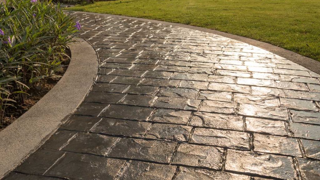 Decorative concrete walkway 2 Types of decorative concrete options include this dark walkway