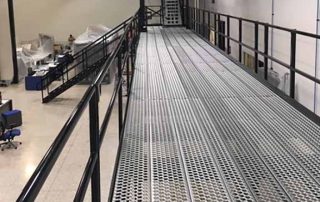 Black and silver walkway, catwalk or work platform, as a part of material handling equipment