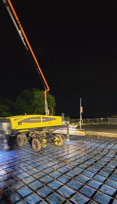 Yellow Laser Screed machine at project in Belton, MO