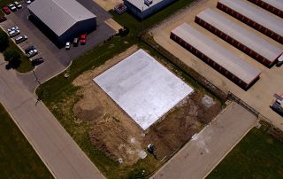 Drone view of the beginning of a warehouse flooring foundation